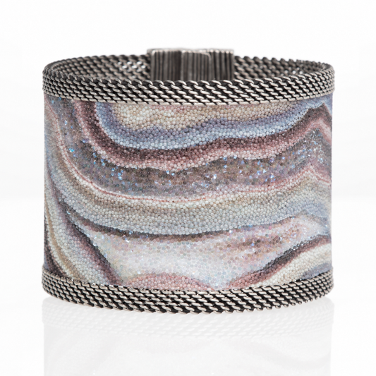 Wide Botswana agate cuff with Swarovski micro-crystals and oxidized silver mesh, shown closed on a white background.